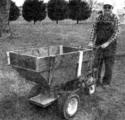 Farmer walking with his homemade Self-Propelled Wheelbarrow