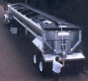 Hopper grain truck equiped with the Shur-Lok roll tarp system