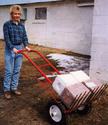 A hay cradle being used to transport four salt blocks