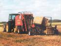 Wray Stacker Big-Bale Accumulator stacking one bale onto another while a third bale is made
