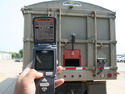 Remote Control Grain Chute Opener attached to a grain truck back gate