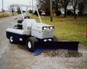 Ventrac Lawn Care Machine with grading blade attached to front