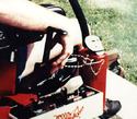 Close-up of modified hand controls on grasshopper lawn mower