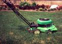 Green pushmower designed for chipping and side ejecting debris