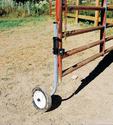 Clamped partway up the latching end of a five-rail steel fence gate is a length of inch-diameter metal tubing thatâ€™s L-shaped at the bottom to which the gate wheel has been affixed.
