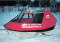 Itâ€™s metal runners on the snow-covered ground is the fully enclosed sled, with panoramic both around and above plus tow bar in the front.