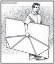 An adult male carries a 4x8 sheet next to his body, his right hand grasping the rope affixed around the sheet as described.