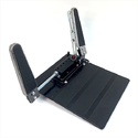 Black rectangular corrugated floor plate with black box mounted on forward end through which goes a silver axel with an accelerator pedal on each end right & left.