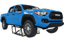 Blue Toyota pickup truck suspended on portable full-vehicle lift jack.