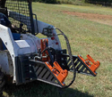 3-Point-Hitch PTO Adapter mounted on front of a skid steer.