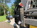 Skid-Steer Trailer Mover Hitch attached to front of a skid-steer.