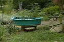 Revolving Wading Pool Raised Bed sitting in a yard garden spot.